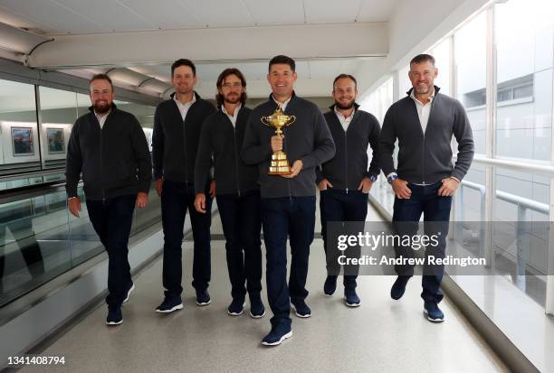 Shane Lowry, Bernd Wiesberger, Tommy Fleetwood, Captain Padraig Harrington, Tyrrell Hatton and Lee Westwood of Team Europe walk to the gate with the...