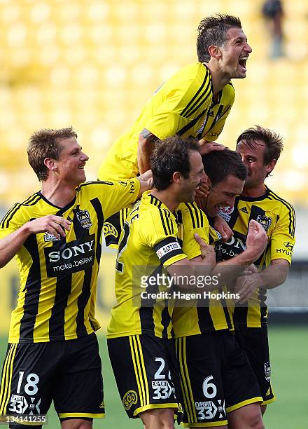 To R, Ben Sigmund, Andrew Durante, Vince Lia, Tim Brown and Nick Ward of the Phoenix celebrate a goal during the round eight A-League match between...