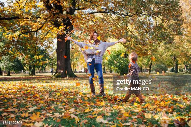 mom and son in the park - september stock pictures, royalty-free photos & images