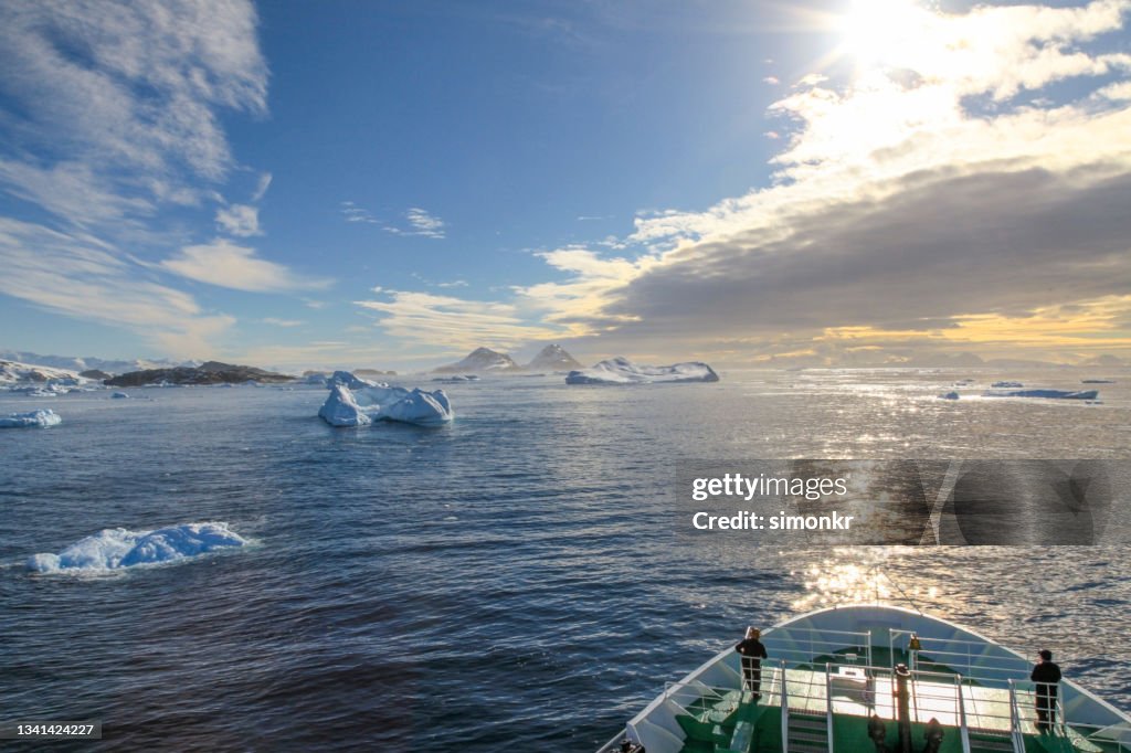 Expedition ship cruising through icebergs