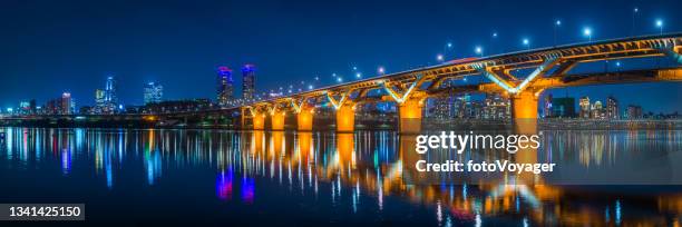 bridge over river to neon night skyscraper cityscape panorama seoul - namsan seoul stock pictures, royalty-free photos & images