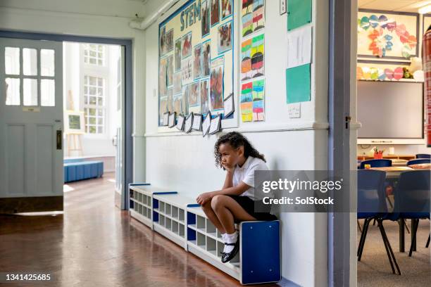 fed up outside classroom - schoolgirl stock pictures, royalty-free photos & images