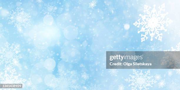 snowflakes on blue background. - snowfall and lights night defocussed stock pictures, royalty-free photos & images