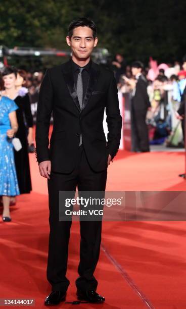 Actor Vic Chou arrives at the red carpet of the 48th Golden Horse Awards at Performance Hall of Cultural Affairs Bureau on November 26, 2011 in...