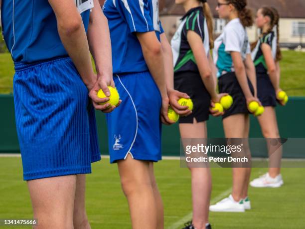 Ball girls and boys in the training and selection programme at the All England Club Community Sports Ground in south London on June 10, 2021 in...