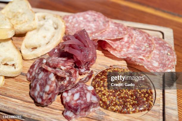 Charcuterie board with various meats, bread, salami and whole grain mustard at Folktale Winery and Vineyard, Carmel, California, September 3, 2021....