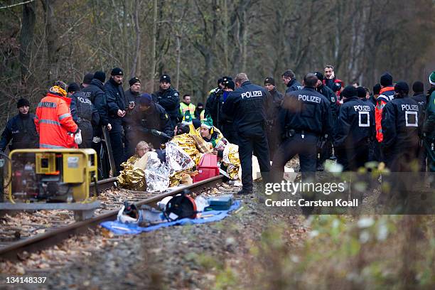 Anti-nuclear protesters are stuck in a concrete block they built on the track that will be used to transport nuclear waste on November 27, 2011 in...