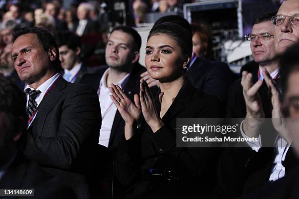 Russian politician and former Olympic Champion, Alina Kabaeva, aplauds as Prime Minister Vladimir Putin delivers his speech at the congress of the...