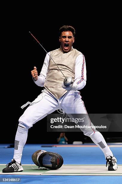 Jamie Davis of Great Britain celebrates his victory over Tommaso Lari of Italy during the Men's Foil Team Event at the Fencing Invitational, part of...