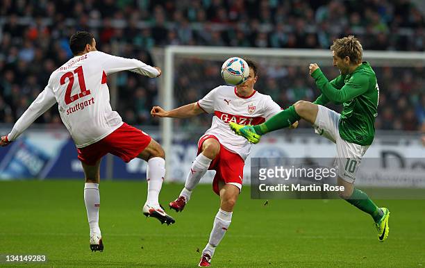 Marko Marin of Bremen and William Kvist of Stuttgart battle for the ball during the Bundesliga match between Werder Bremen and VfB Stuttgart at Weser...