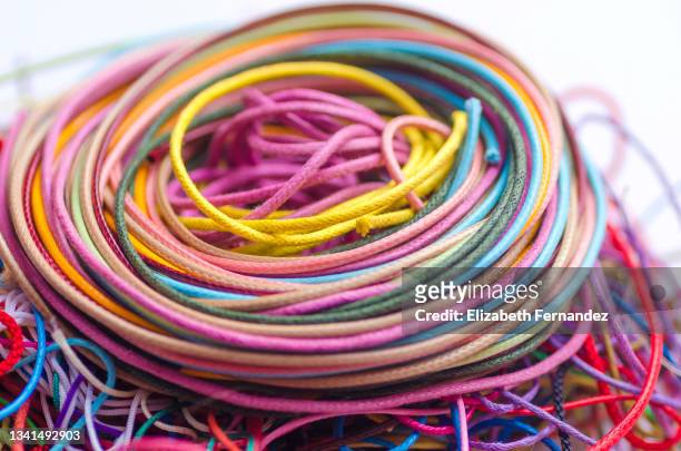 swirl colorful of leather laces together on a white background - rainbow laces stock-fotos und bilder