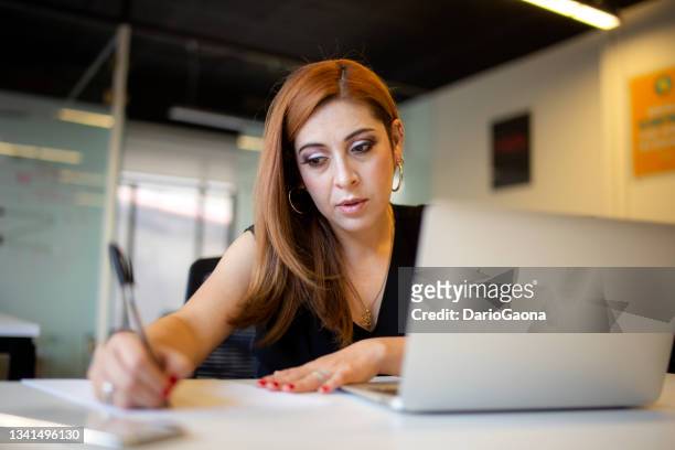 portraits of women in the office - mexican business women stock pictures, royalty-free photos & images