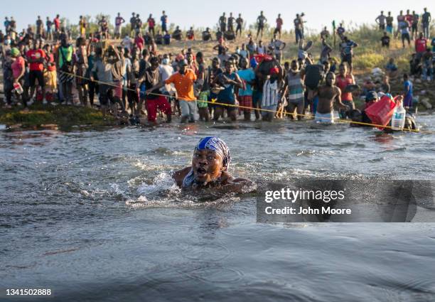 Haitian immigrants cross the Rio Grande back into Mexico from Del Rio, Texas on September 20, 2021 to Ciudad Acuna, Mexico. As U.S. Immigration...