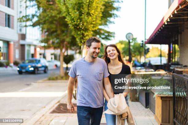 millennial male and female couple in the city midwest photo series - champaign illinois stock pictures, royalty-free photos & images