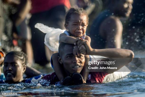 Haitian immigrants cross the Rio Grande back into Mexico from Del Rio, Texas on September 20, 2021 to Ciudad Acuna, Mexico. As U.S. Immigration...