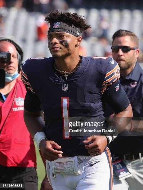 Justin Fields of the Chicago Bears leaves the field after a win against the Cincinnati Bengals at Soldier Field on September 19, 2021 in Chicago,...