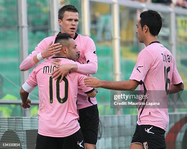 Fabrizio Miccoli of Palermo celebrates with team-mates Josip Ilicic and Eran Zahavi after scoring the opening goal of the Serie A match between US...