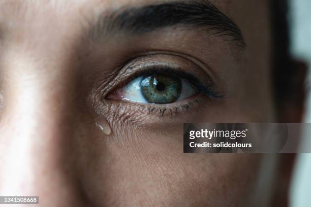 crying woman - close up of eye stock pictures, royalty-free photos & images