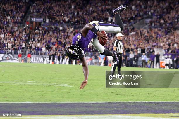 Lamar Jackson of the Baltimore Ravens flips into the end zone for a touchdown against the Kansas City Chiefs during the fourth quarter at M&T Bank...