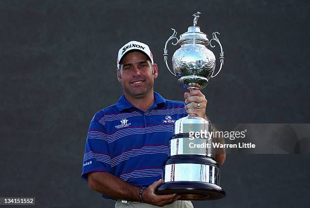 Hennie Otto of South Africa poses with the trophy after winning the South African Open Championship at Serengeti Golf Club on November 27, 2011 in...