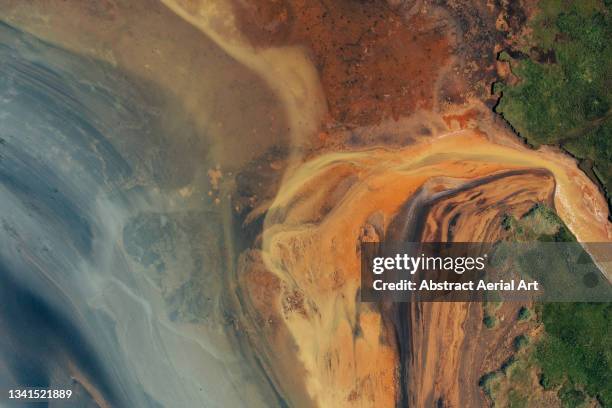 silt flowing from a braided river seen from above, iceland - tide rivers stock pictures, royalty-free photos & images