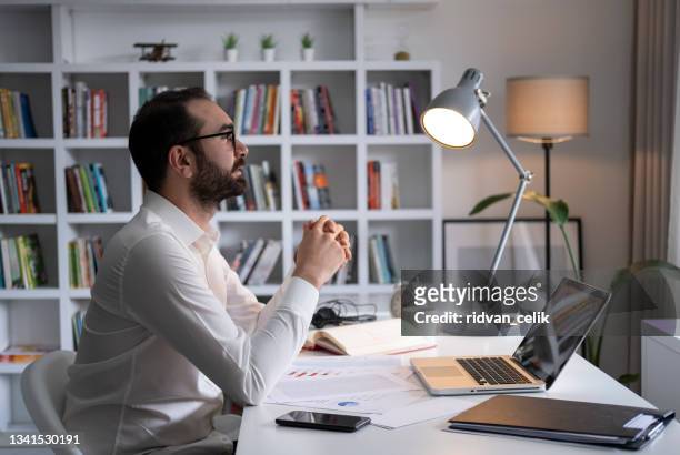 businessman working on financial report of corporate operations, balance - shareholder stock pictures, royalty-free photos & images