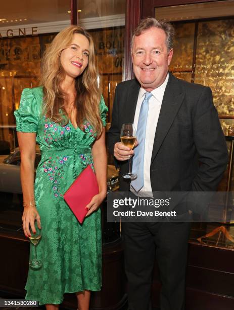 Celia Walden and Piers Morgan attend the Burlington Arcade 007 installation launch, in partnership with EON Productions and Universal Pictures...