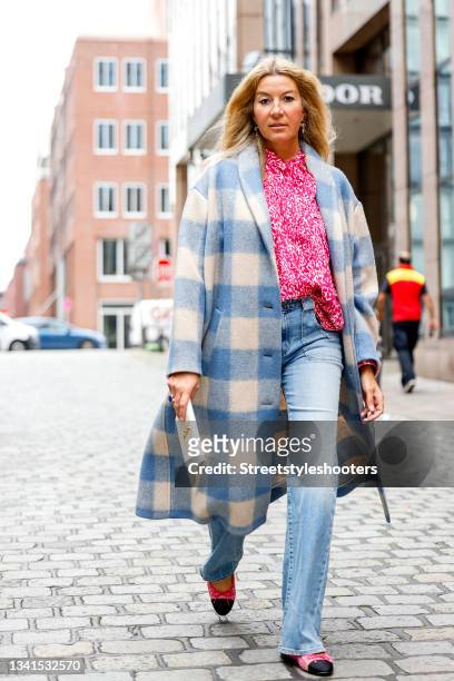 September 20: Yasmin von Schlieffen-Nannen, wearing a pink patterned blouse by Isabel marant, a Jeans by Nili Lotan, a blue-white checked coat by...