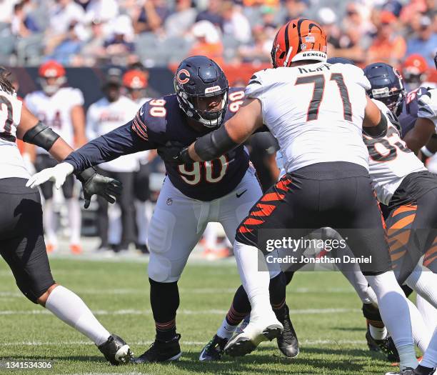 Angelo Blackson of the Chicago Bears rushes against Riley Reiff of the Cincinnati Bengals at Soldier Field on September 19, 2021 in Chicago,...