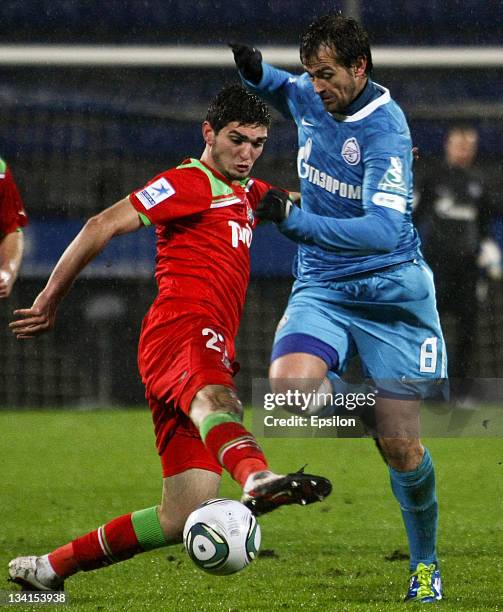 Magomed Ozdoyev of FC Lokomotiv Moscow in action against Danko Lazovic of FC Zenit St Petersburg during the Russian Premier League match between FC...