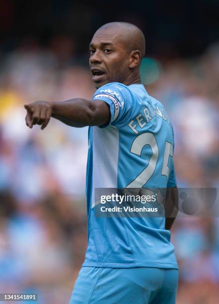 Fernandinho of Manchester City instructs his team before defending a free kick during the Premier League match between Manchester City and...