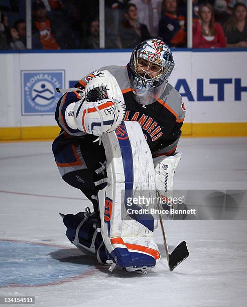 Rick DiPietro of the New York Islanders skates in warmups prior to the game against the Philadelphia Flyers at the Nassau Veterans Memorial Coliseum...