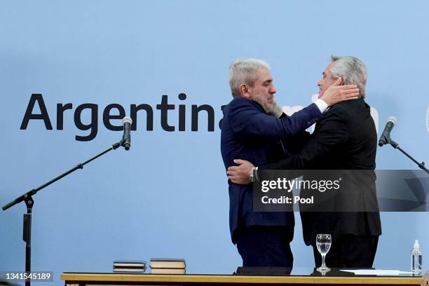 President of Argentina Alberto Fernandez greets newly appointed Minister of Security Anibal Fernandez during the swearing in ceremony at Museo del...