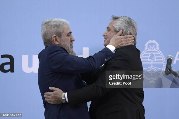 President of Argentina Alberto Fernandez greets newly appointed Minister of Security Anibal Fernandez during the swearing in ceremony at Museo del...