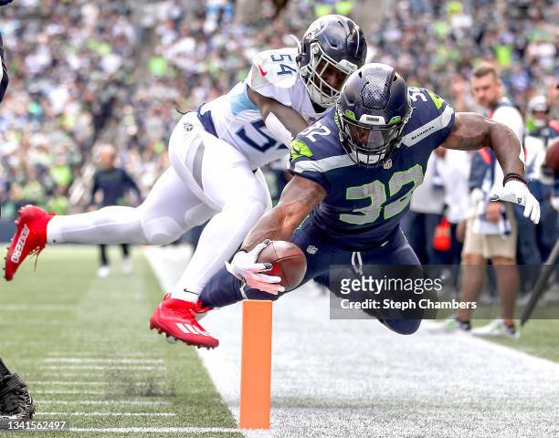 Rashaan Evans of the Tennessee Titans forces Chris Carson of the Seattle Seahawks shy of a touchdown during the second quarter at Lumen Field on...