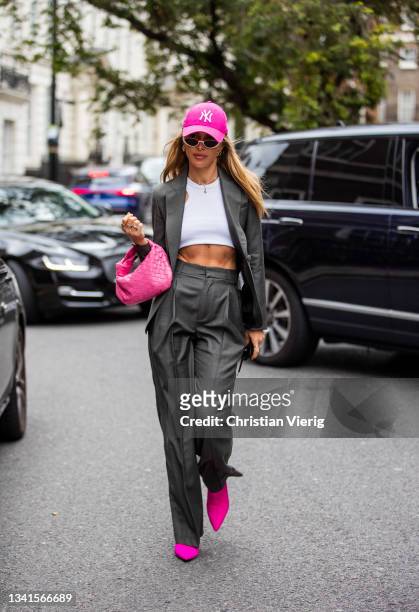 Maja Malnar is seen waring pink cap, grey suit, pink Bottega Veneta bag outside Paul & Joe during London Fashion Week September 2021 on September 20,...