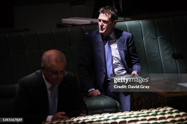 Attorney-General Christian Porter sits behind Australian Prime Minister Scott Morrison during Question Time in the House of Representatives at...