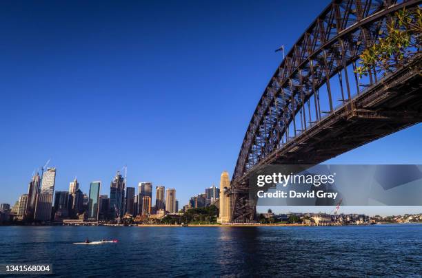 Two people in kayaks paddle under the Sydney Harbour Bridge on September 17, 2021 in Sydney, Australia.
