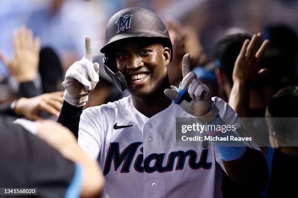Jesus Sanchez of the Miami Marlins celebrates after hitting a two-run home run off Erick Fedde of the Washington Nationals during the third inning at...