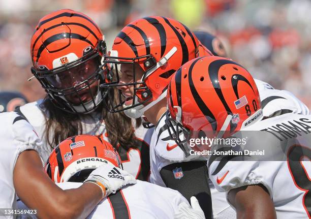 Joe Burrow of the Cincinnati Bengals calls a play in the huddle against the Chicago Bears at Soldier Field on September 19, 2021 in Chicago,...