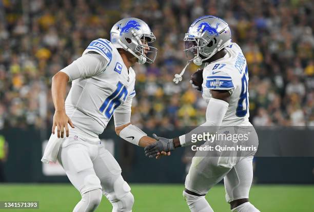 Quintez Cephus of the Detroit Lions celebrates a touchdown with teammate Jared Goff during the first half against the Green Bay Packers at Lambeau...