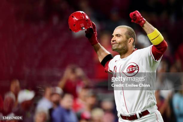 Joey Votto of the Cincinnati Reds celebrates his two-run home run in the third inning during their game against the Pittsburgh Pirates at Great...