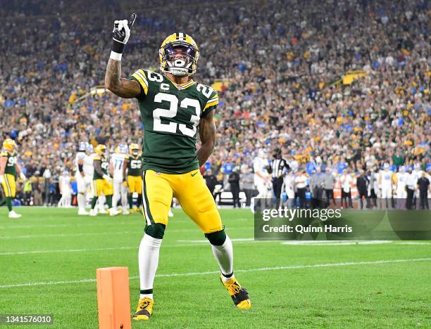 Jaire Alexander of the Green Bay Packers reacts after breaking up a pass against Amon-Ra St. Brown of the Detroit Lions during the first half at...