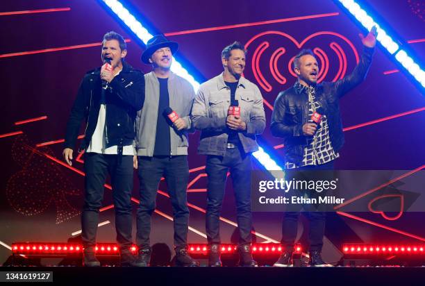 Nick Lachey, Justin Jeffre, Jeff Timmons and Drew Lachey of 98 Degrees introduce a performance by J. Cole during the 2021 iHeartRadio Music Festival...