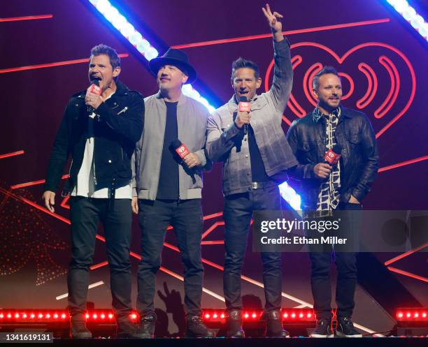 Nick Lachey, Justin Jeffre, Jeff Timmons and Drew Lachey of 98 Degrees introduce a performance by J. Cole during the 2021 iHeartRadio Music Festival...