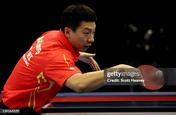 Ma Long of China in action against Zhang Jike during the Men's Singles Final during day four of the ITTF Pro Tour Table Tennis Grand Finals at ExCel...