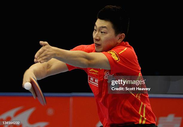 Ma Long of China in action against Zhang Jike during the Men's Singles Final during day four of the ITTF Pro Tour Table Tennis Grand Finals at ExCel...