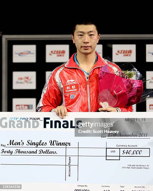 Ma Long of China stands on the podium after winning the Men's Singles Final against Zhang Jike during day four of the ITTF Pro Tour Table Tennis...