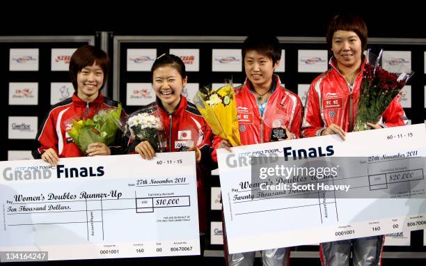 Guo Yue and Li Xiaoxia of China stand on the podium after winning their Women's Doubles Final match against Ai Fukuhara and Ishikawa Kasumi of Japan...