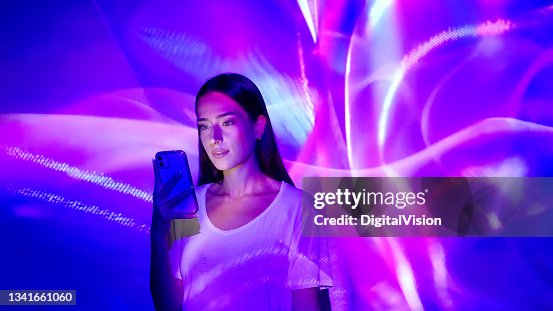 Image projection on a woman using a smart phone Image projection on a woman using a smart phone